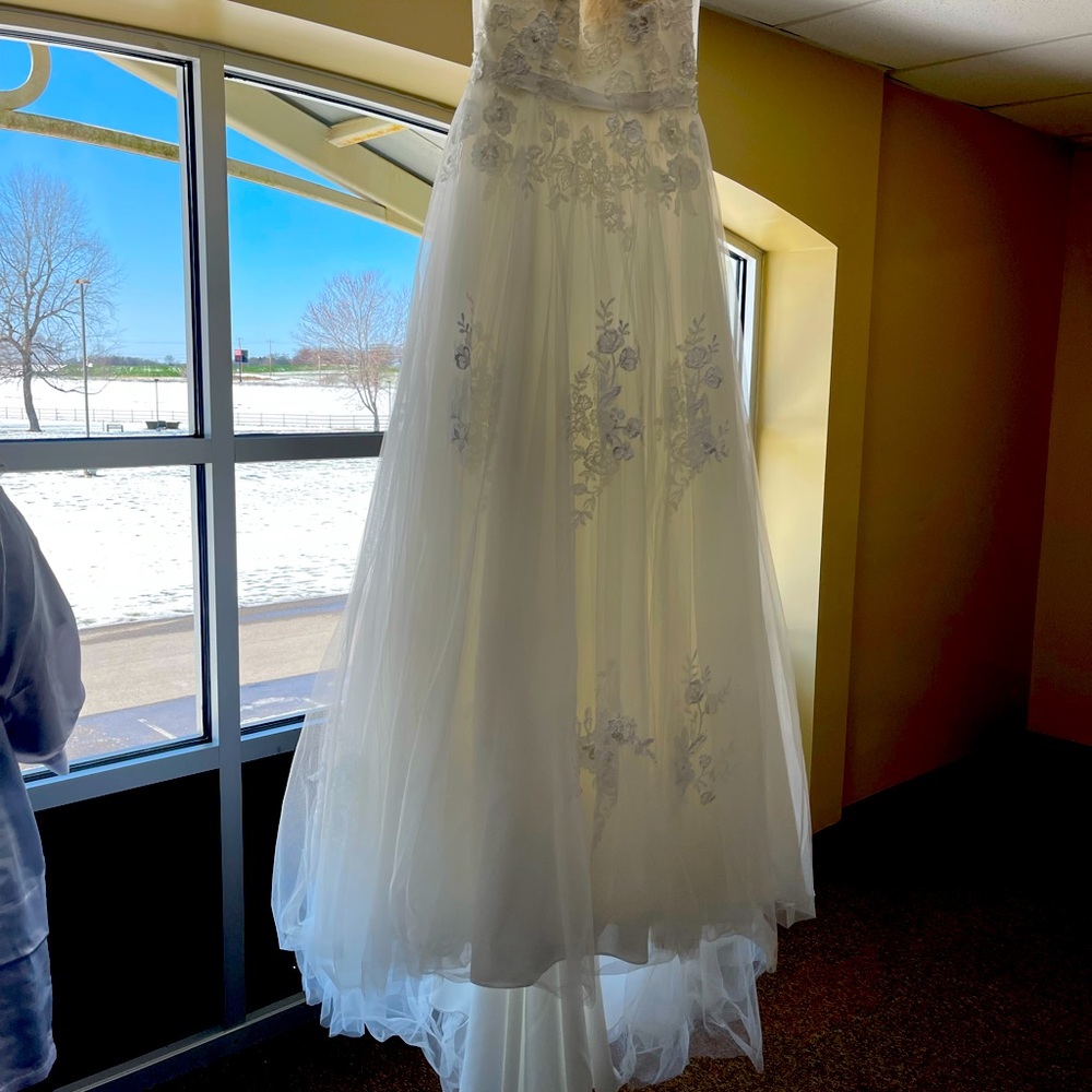 Wedding dress from David’s bridal wore once includes veil and shoes and slip